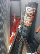 Contents of Corridor beside Container against building comprising; Road Signs; Safety Bollards, Flat Trolleys; 2 x Rolls of Mesh; Timber