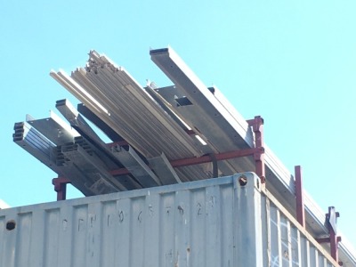 Large Stillage Containing various Galvanised Item Track & 2 x Packs on the ground