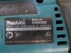 Makita Hammer Drill, 18 Volt, DHR202, No Battery
2 x Chargers, DC18RC, DC18WA
1 x Makita Light, DML805 with Cord - 3