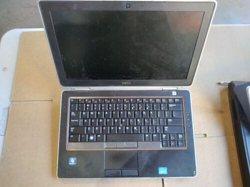 DNL Dell Latitude | No HardDrive [S/N: has beenremoved ] w/ bottom attachment | no Charger, missing cd eject cover , Damage, scratches and scuff marks.