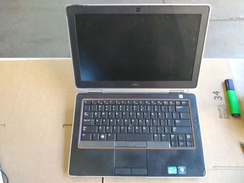 DNL Dell Latitude E6320 | No HardDrive [S/N: has beenremoved ] w/ bottom attachment | no Charger, missing cd eject cover , Minor Damage, rubber screen rim peeling back, scratches and scuff marks.