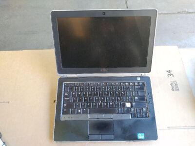 DNL Dell Latitude E6330 | No HardDrive [S/N: HCX3LX1 ] w/ bottom attachment | no Charger, missing 2of7 backing screws, Damage, scratches and scuff marks.