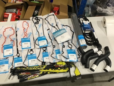 Box of automotive gaskets, radiator hose, v and poly v belts, bonnet gas strut. Please refer to images of items.