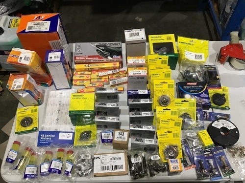 Box of thermostats, restoration kit, wheel studs, spark plug packs, oil filter cap, ignition lead sets, starter motor etc. Please refer to images of items.