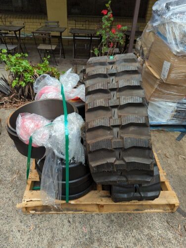 Bulk pallet of rubber tracks and brake drums. Please refer to images of items.