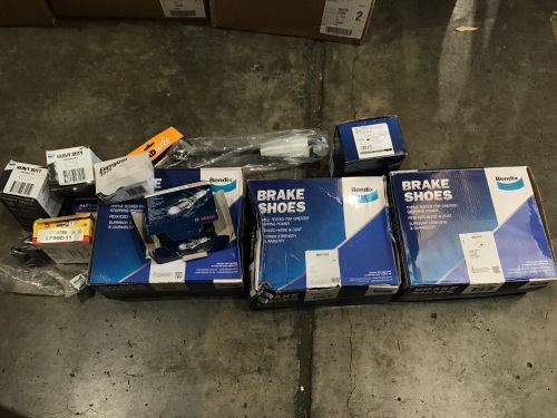 Box of brake shoes, brake pads, spark plugs etc. Please refer to images of items.