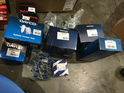 Box of timing belt kits, radiator coolant, strut mounts. Please refer to images of items.