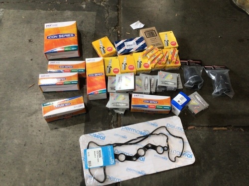 Box of NGK spark plugs gaskets and filters. Please refer to images of items.