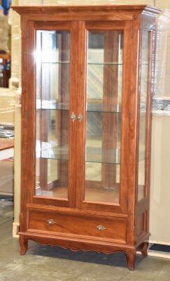 2 Door Timber Display Cabinet. Has 3 glass shelves, with 2 LED Down lights plus a bottom drawer. Dimensions 1100W x 480D x 2000H mm.