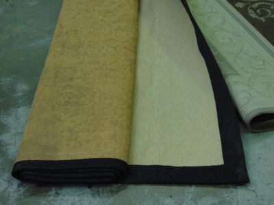 Pallet of 4 x Assorted water damaged rugs. Rugs have dirt and water stains