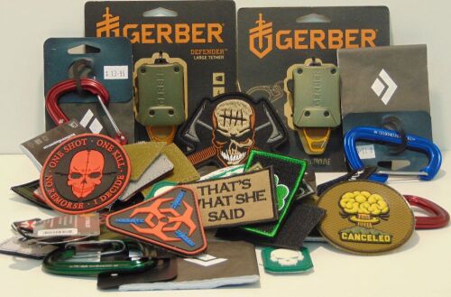 Carton of assorted carabiners and velcro patches.