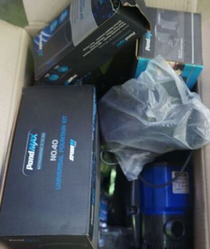 DNL Carton of assorted pond accessories including Pondmax fountain kit, Pond max pump, filters and more.