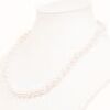 Lovely Single Strand Of Japanese Semi Baroque Akoya Pearls On White Silk.
