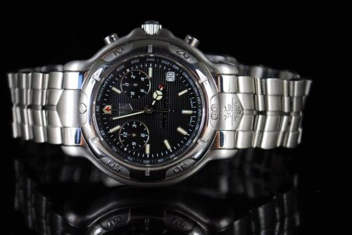 DNL Retail Replacement Value $8,325.00 - One New Authentic Gents Tag Heuer 6000 Series 1/10th chronograph "Limited Edition" wrist watch with a black dial.