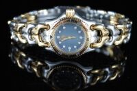 DNL Retail Replacement Value $24,000.00 - One New Authentic Ladies Tag Heuer S/EL series “Limited Edition" wrist watch with a Grey dial with 11 single cut claw set diamonds.