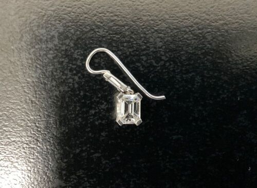 2x Diamond Earring. - Emerald Cut 1.11ct H VS1. Smaller Diamond 0.14c placed in a 18ct White Gold Diamond Earring