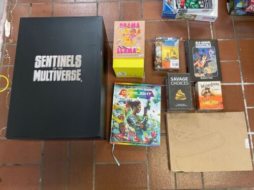 Bundle of Sentinels of the Multiverse, Obama Llama 2, Overlight book, Marvel Miniature Game, Old-School Essentials book, Savage Choices, Western Legends Expansion and Folder Space game Inserts.