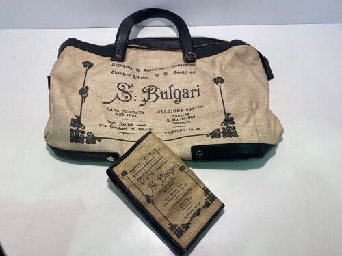 One used Bulgari labelled cloth & leather handbag and one Bulgari labelled cloth & leather womens wallet