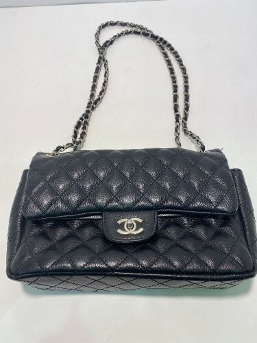 One used Chanel labelled leather handbag