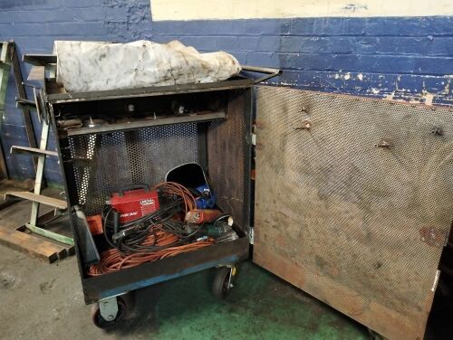 Welding trolley with contents, welder included.