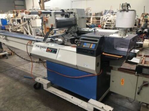 FUJI MOTORISED PNEUMATIC FORM, FILL, WRAP AND SEAL MACHINE Model: EW3400-R, S/N: 084009 with Pass Through Conveyor, Take-Out Conveyor, Overhead Wrap Feed-Out System, Touch Pad Control to 415V 3 Phase Electric Motor and Switch Mounted on Mobile Base