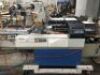 FUJI MOTORISED PNEUMATIC FORM, FILL, WRAP AND SEAL MACHINE Model: EW3400-R, S/N: 084009 with Pass Through Conveyor, Take-Out Conveyor, Overhead Wrap Feed-Out System, Touch Pad Control to 415V 3 Phase Electric Motor and Switch Mounted on Mobile Base - 7