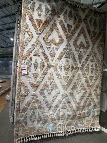 Geometric Pattern Tufted Area Rug, multicolor raised pile design, white base, fringe tassels on ends