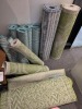 Fixture inc mix welcome mats and 10x mix quantities of small rugs (unknown size) Must take fixture - 5