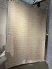 Large beige rug with handwoven texture, dimensions 300 x 200 cm