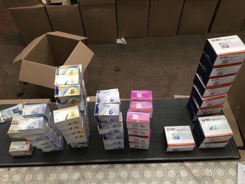 Approximately 88 assorted boxes of syringes or needle caps