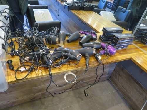 Tub containing used Hair Dryers, Flat Irons and Curling Wands
